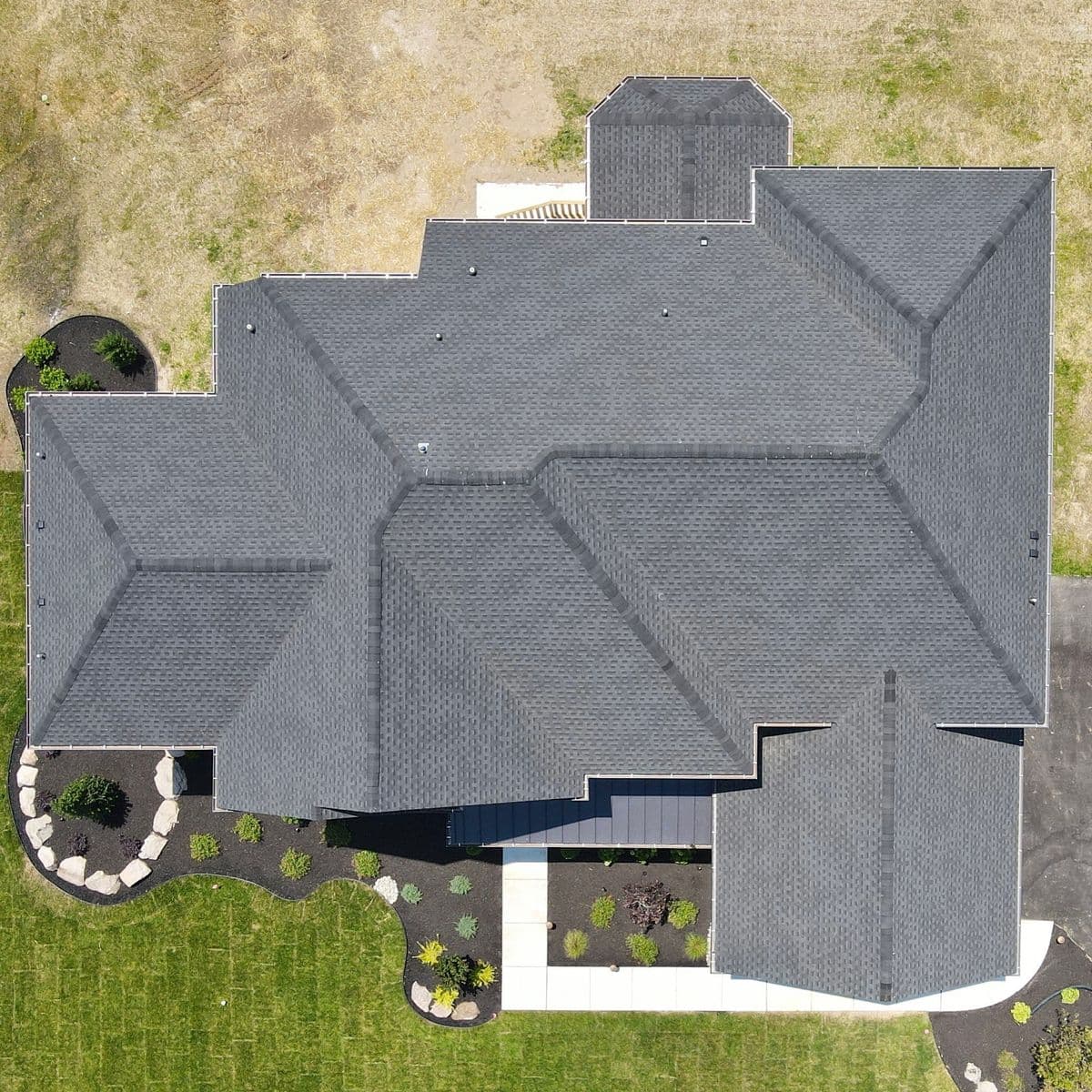 Aerial view of a residential roof after storm damage restoration
