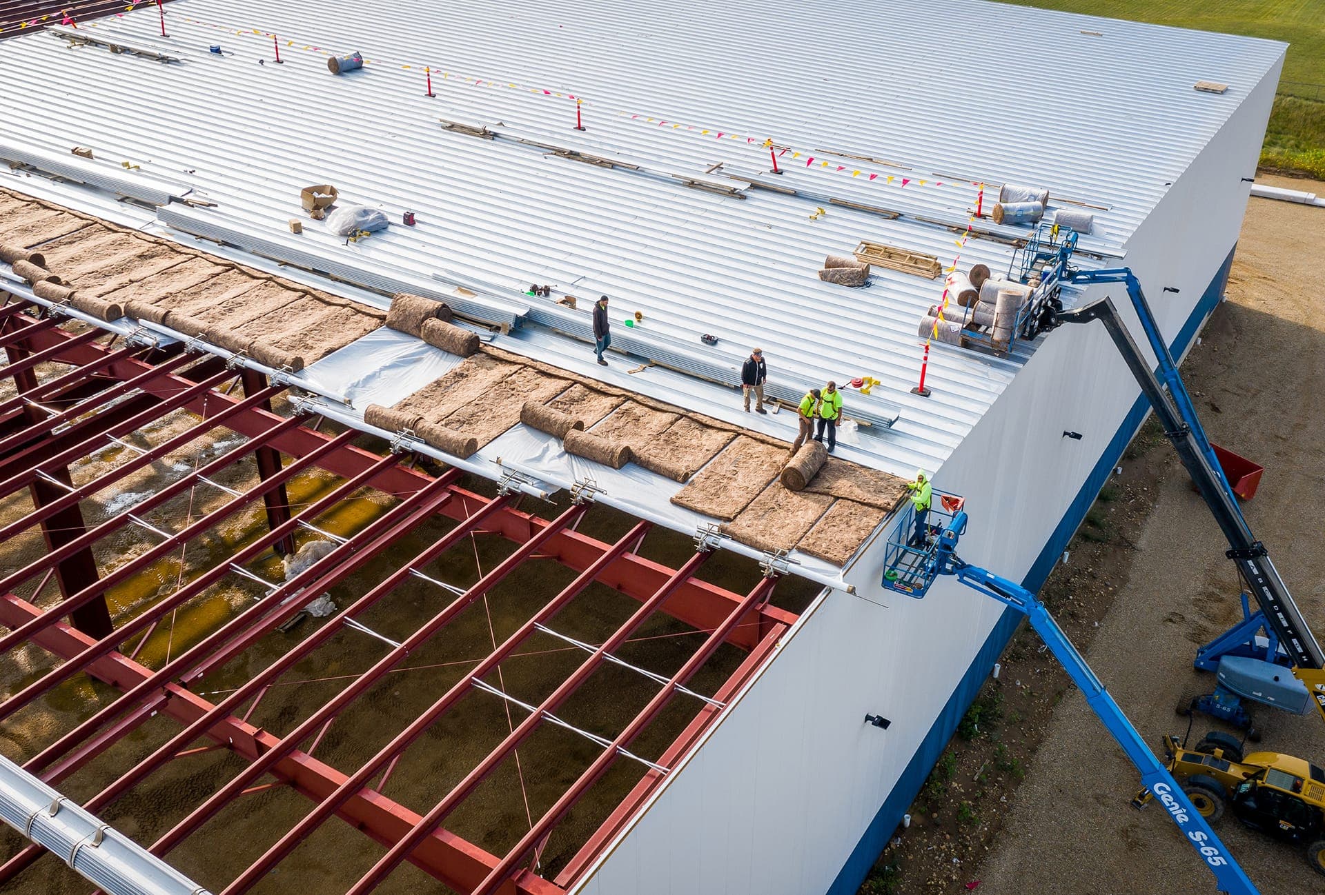Commercial roofing crew installing a low-slope roof